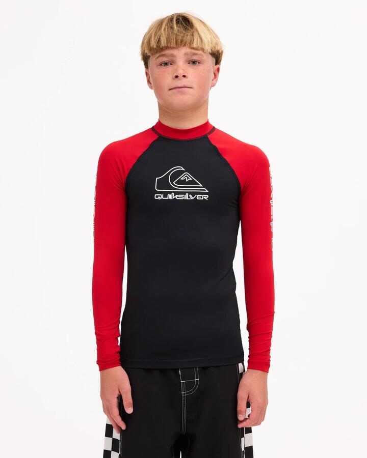 Image of a model wearing Tops. Product name - Surf Dive 'n Ski Boys 8-16 On Tour Long Sleeve Id Rashguard Black/Salsa in Black/Salsa colour by brand - Surf Dive 'n Ski