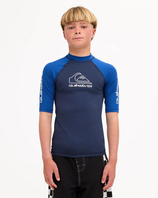 Image of Wetsuits. Product name - Surf Dive 'n Ski Boys 8-16 On Tour Id Rashguard Mood Indigo in Mood Indigo colour by brand - Surf Dive 'n Ski