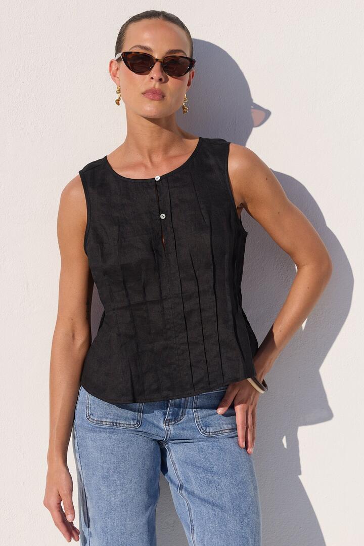 Image of a model wearing Tops. Product name - Encourage Black Linen Pintuck Front Boatneck Top in Black Linen colour by brand - Stories be Told