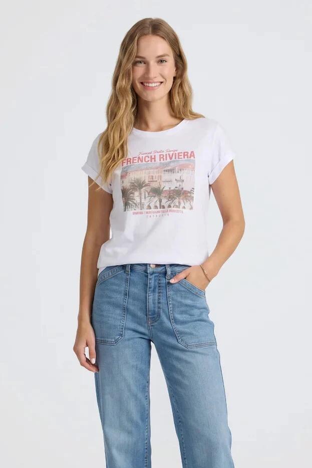 Image of a model wearing Tops. Product name - Cannes White French Riviera Printed SS Tee in White colour by brand - Foxwood
