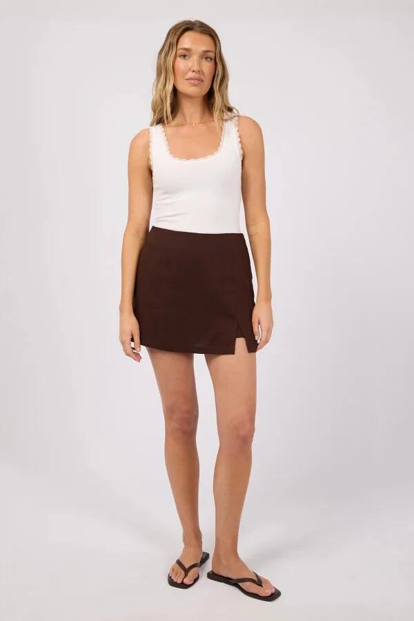 Image of a model wearing Skirts. Product name - Fern Brown Linen Skort in Brown colour by brand - All About Eve
