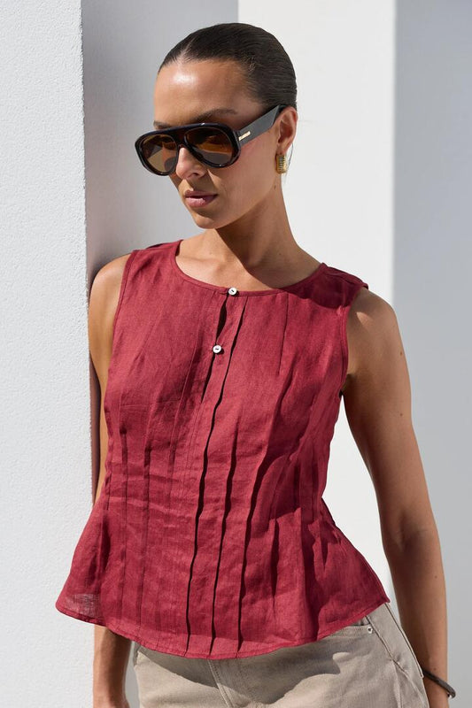 Image of a model wearing Tops. Product name - Encourage Wine Linen Pintuck Front Boatneck Top in Wine Linen colour by brand - Stories be Told