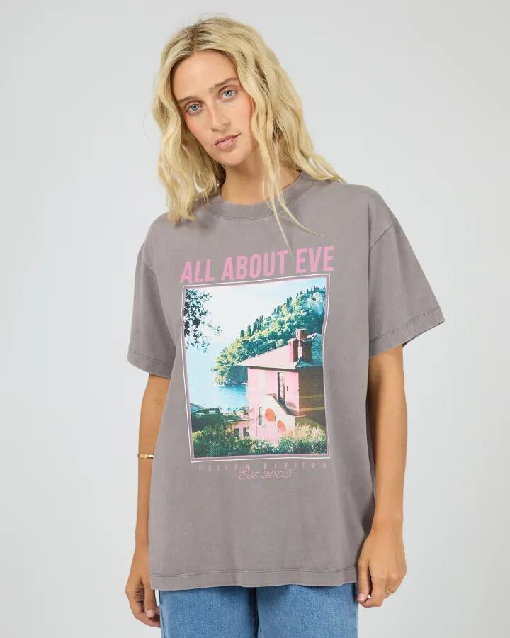 Image of a model wearing Tops. Product name - Provence Charcoal Graphic Print Relaxed Tee in Grey colour by brand - All About Eve