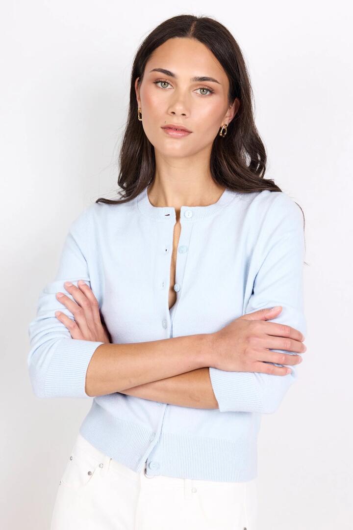 Image of a model wearing Outerwear. Product name - Autograph Ice Blue Soft Fine Gauge Crewneck Cardigan in Ice Blue colour by brand - Stories be Told