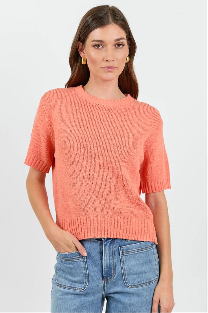 Image of a model wearing Outerwear. Product name - Loveable Melon Tape Yarn Knit Tee in Melon colour by brand - By Rosa.