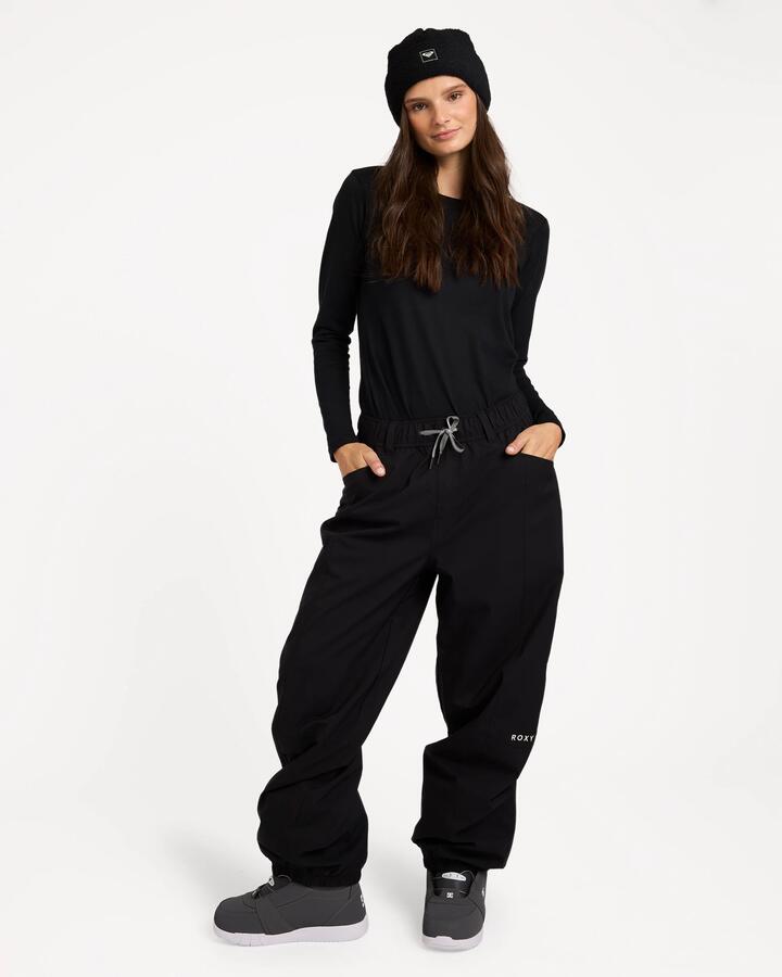 Image of a model wearing Pants. Product name - Roxy Womens Winter Vibe Snow Pants Blk in Blk colour by brand - Roxy