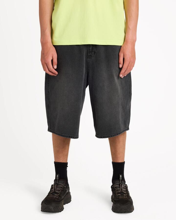 Image of a model wearing Shorts. Product name - Surf Dive 'n Ski Mens Spec 73 Denim Shorts Black in Black colour by brand - Surf Dive 'n Ski