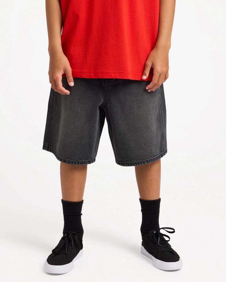 Image of a model wearing Shorts. Product name - Surf Dive 'n Ski Boys 8-16 Boys Spec 73 Denim Shorts Black in Black colour by brand - Surf Dive 'n Ski