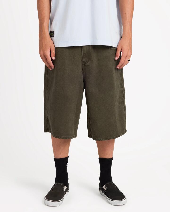 Image of a model wearing Shorts. Product name - Surf Dive 'n Ski Mens Immortal Baggy Denim Shorts Bong Water Wash in Bong Water Wash colour by brand - Surf Dive 'n Ski