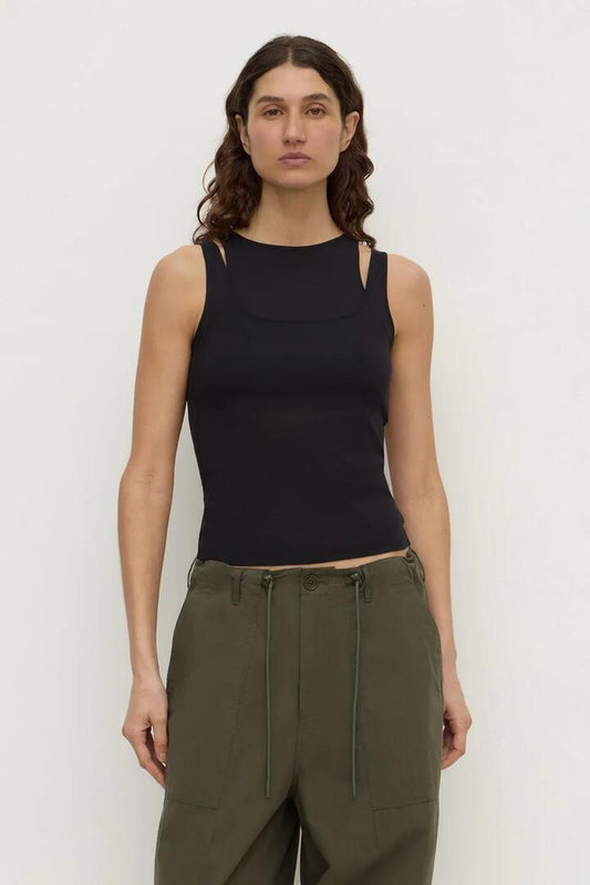 Image of a model wearing Tops. Product name - Mika Black Jersey Layered Tank in Black colour by brand - Assembly Label