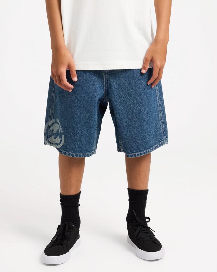 Image of a model wearing Shorts. Product name - Billabong Boys 8-16 Boys Spec 73 Baggy Denim Shorts Ocean Wash in Ocean Wash colour by brand - Billabong
