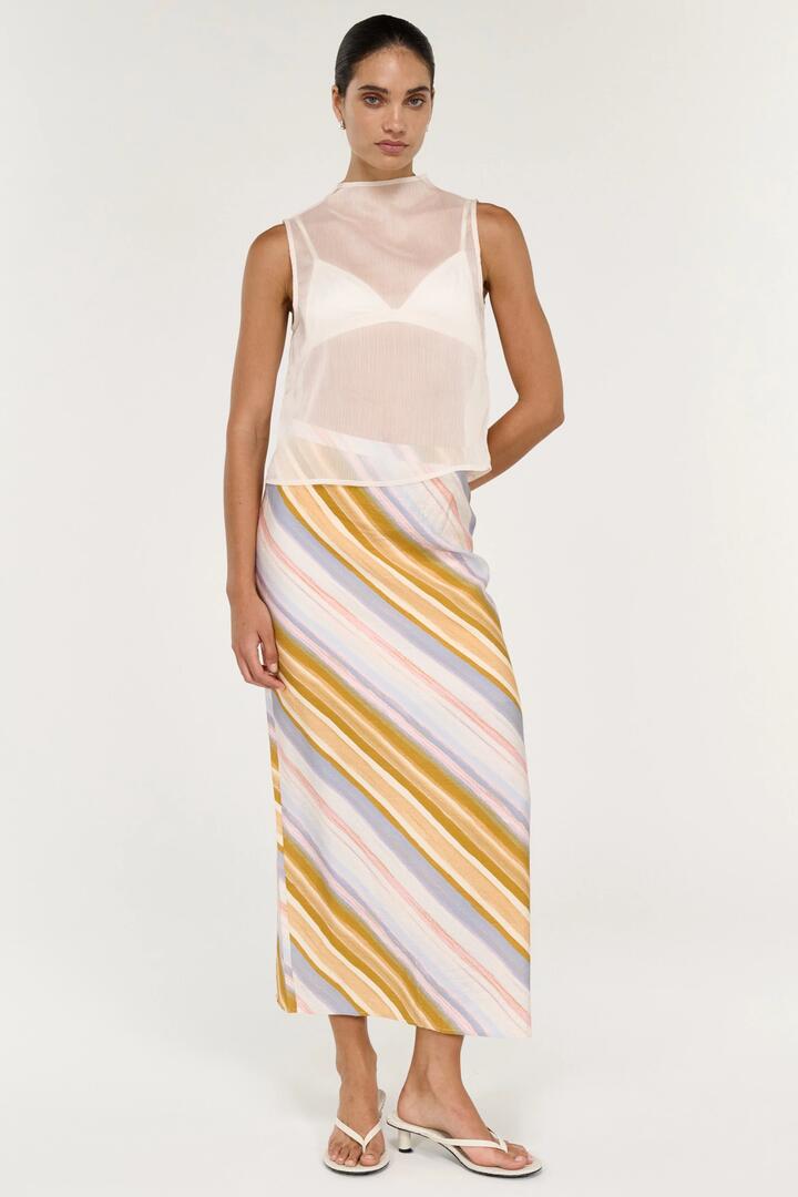 Image of a model wearing Skirts. Product name - Veda Gold Multi Stripe Midi Skirt in Yellow colour by brand - Staple The Label