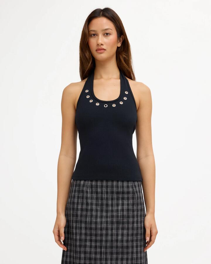 Image of a model wearing Tops. Product name - Volcom Womens Metal Halter Top Black in Black colour by brand - Volcom