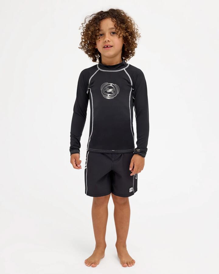 Image of a model wearing Tops. Product name - Billabong Boys 2-7 Groms Spec 73 Upf 50 Long Sleeve Rashguard Black in Black colour by brand - Billabong