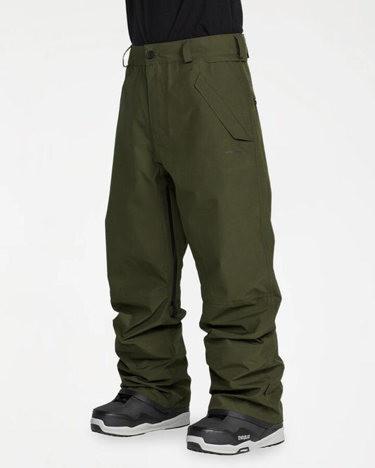 Image of a model wearing Pants. Product name - Volcom Mens Test Gore-Tex Pants Dark Green in Dark Green colour by brand - Volcom