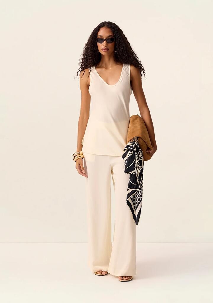 Image of a model wearing Tops. Productname: Posey Tank Top in Ivory colour by brand - MOS The Label