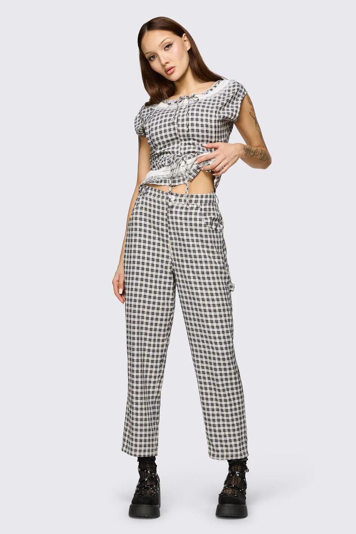 Image of a model wearing Pants. Product name - Darling Gingham Cargo in Black/White colour by brand - Dangerfield
