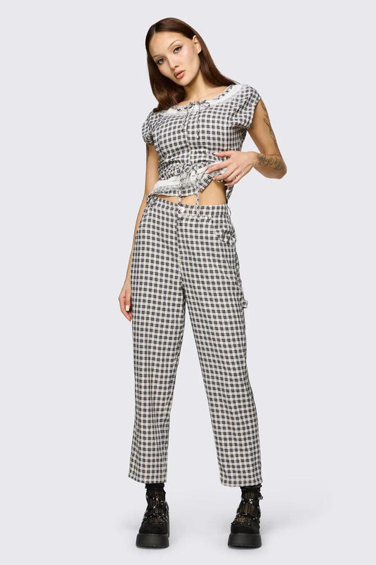 Image of a model wearing Pants. Product name - Darling Gingham Cargo in Black/White colour by brand - Dangerfield