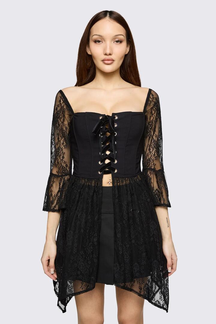 Image of a model wearing Tops. Product name - Affinity Goth Lace Top in Black colour by brand - Black Friday
