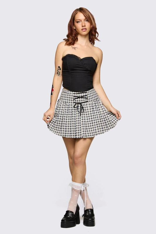 Image of a model wearing Skirts. Product name - Darling Gingham Skort in Black/White colour by brand - Dangerfield