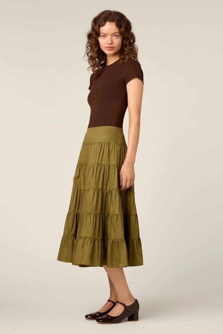 Image of a model wearing Skirts. Product name - Gillie Tiered Midi Skirt in Olive colour by brand - Princess Highway