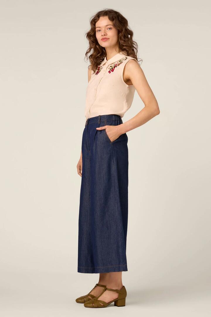 Image of a model wearing Pants. Product name - Joe Classic Denim Culotte in Blue Denim colour by brand - Princess Highway