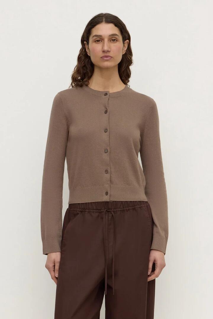 Image of a model wearing Outerwear. Product name - Orina Dark Sand Cotton Cashmere Cardigan in Natural colour by brand - Assembly Label