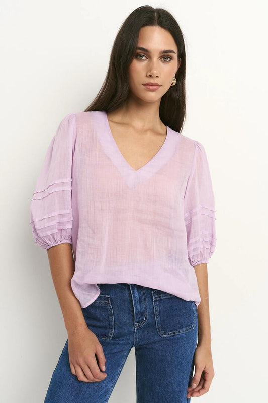 Image of a model wearing Tops. Product name - Recall Lilac Ramie Pleat Sleeve Crew Top in Lilac Ramie colour by brand - Ivy + Jack
