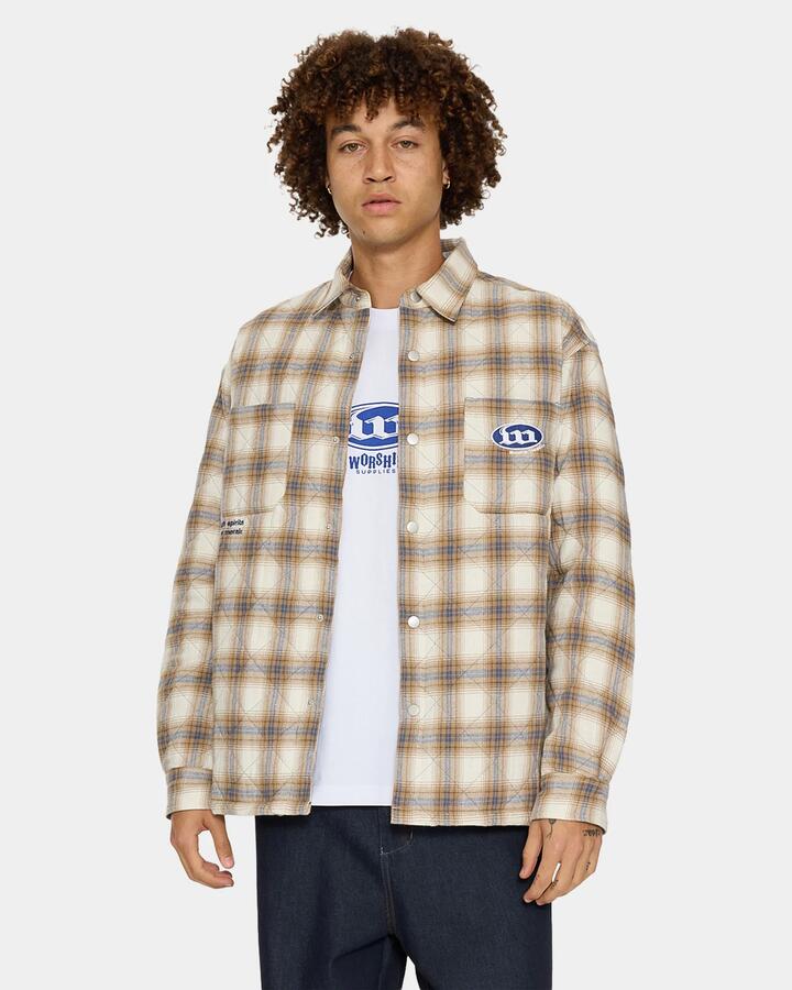 Image of a model wearing Outerwear. Product name - Worship Mens Morality Quilted Shacket Tan in Tan colour by brand - Worship
