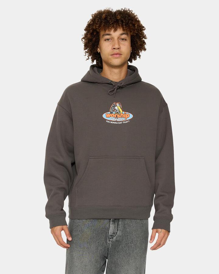 Image of a model wearing Outerwear. Product name - Worship Mens Still Hungry Pullover Hoodie Worn Black in Worn Black colour by brand - Worship
