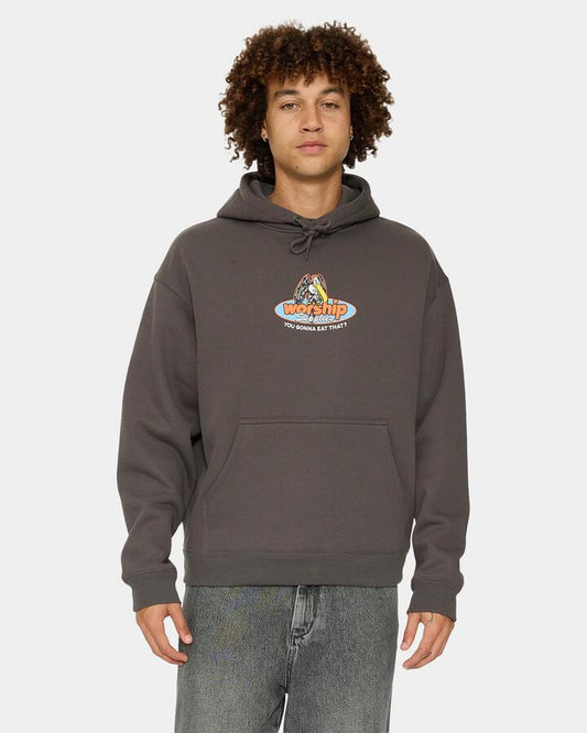 Image of a model wearing Outerwear. Product name - Worship Mens Still Hungry Pullover Hoodie Worn Black in Worn Black colour by brand - Worship