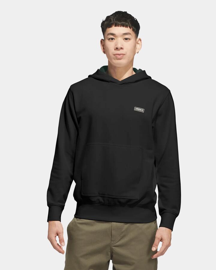 Image of a model wearing Outerwear. Product name - adidas Mens Gonzales Skate Head Pullover Hoodie Black in Black colour by brand - Adidas