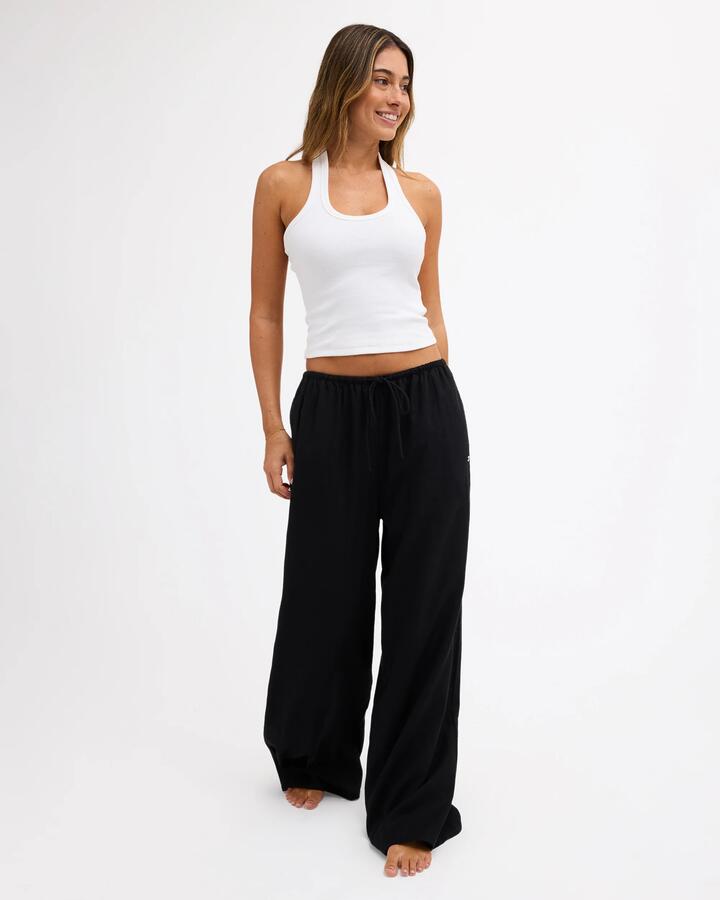 Image of a model wearing Pants. Product name - Roxy Womens Lolani Elastic Waist Pants Black in Black colour by brand - Roxy