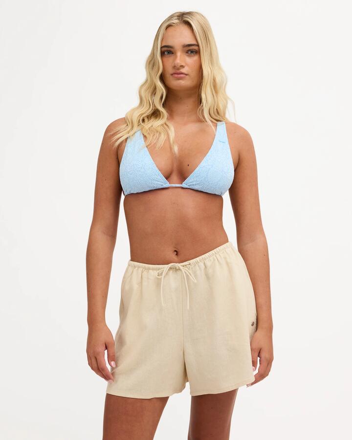 Image of a model wearing Shorts. Product name - Roxy Womens Lolani Elastic Waist Shorts Parchment in Parchment colour by brand - Roxy
