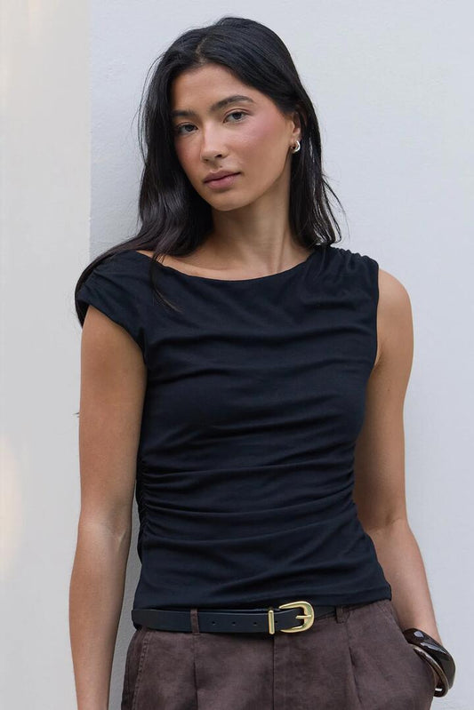 Image of a model wearing Tops. Product name - Backstreet Black Stretch Boat Neck Sleeveless Top in Black Stretch colour by brand - Stories be Told
