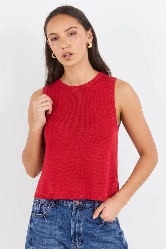 Image of a model wearing Outerwear. Product name - Salute Red Relaxed Sleeveless Knit Top in Red colour by brand - Among the Brave