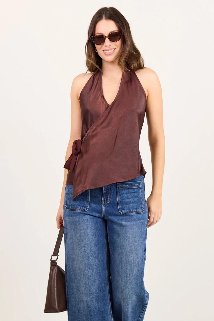 Image of a model wearing Tops. Product name - Replete Chocolate Satin Halter Neck Wrap Front Top in Chocolate colour by brand - Georgia Zoe