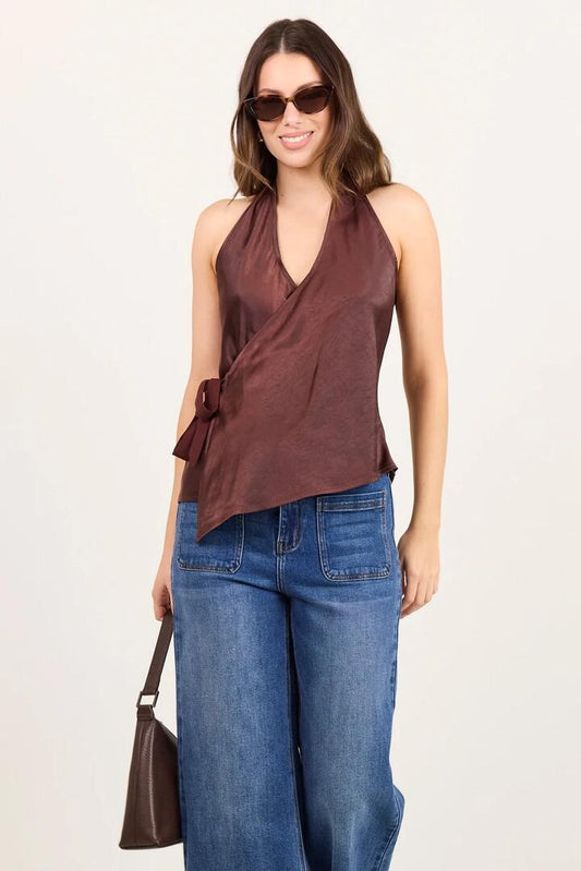 Image of a model wearing Tops. Product name - Replete Chocolate Satin Halter Neck Wrap Front Top in Chocolate colour by brand - Georgia Zoe