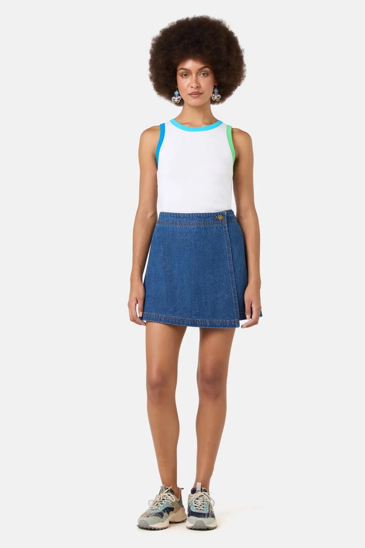 Image of a model wearing Skirts. Product name - Charlotte Denim Skort in Mid Blue colour by brand - Gorman