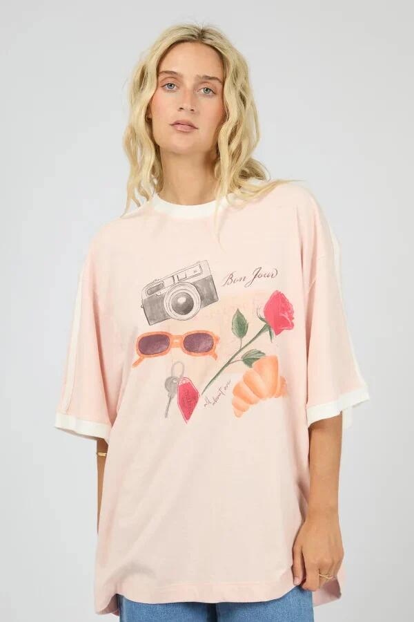 Image of a model wearing Tops. Product name - From France Pink Print Oversized Tee in Pink colour by brand - All About Eve
