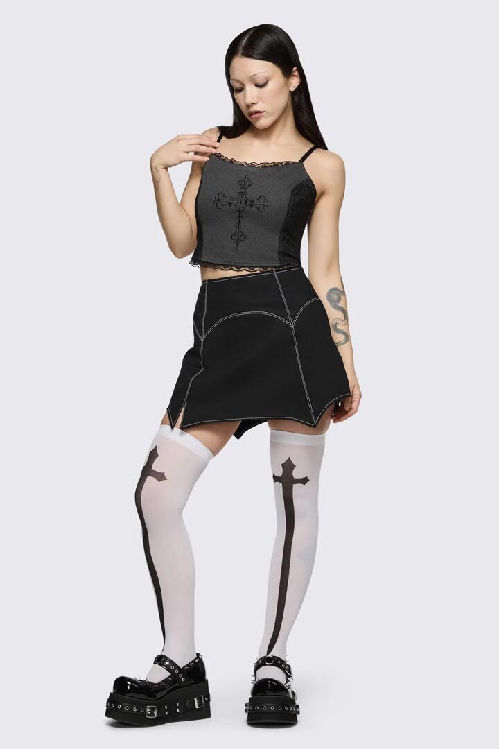 Image of a model wearing Skirts. Product name - Goth Bat Skort in Black colour by brand - Black Friday