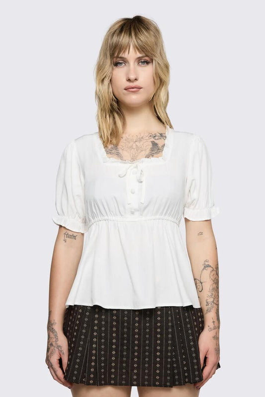 Image of a model wearing Tops. Product name - Low Whisper Flowy Top in Cream colour by brand - Black Friday