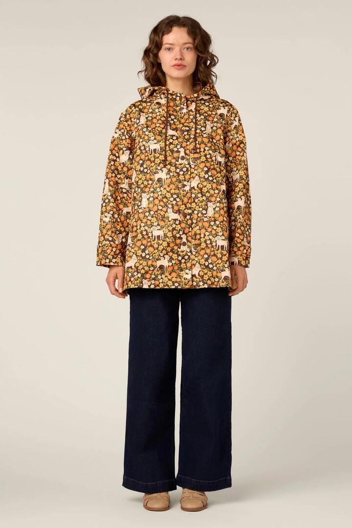 Image of a model wearing Rain Coats. Product name - Dogs & Flowers Raincoat in Chocolate colour by brand - Princess Highway