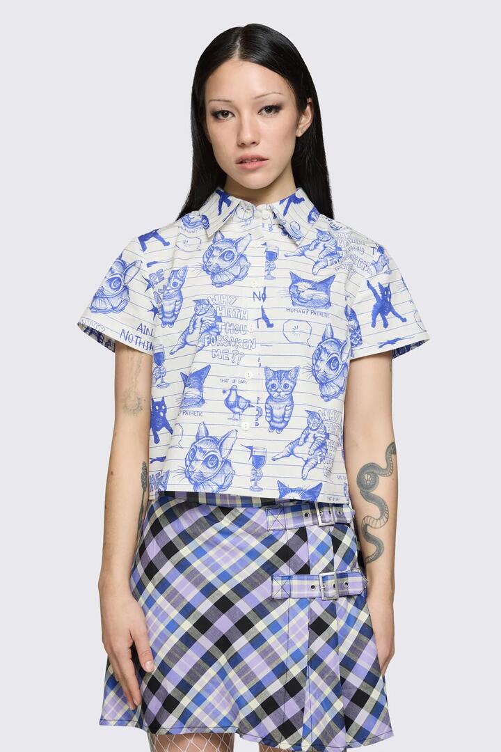 Image of a model wearing Tops. Product name - Sketchy Short Sleeve Blouse in White/Purple colour by brand - Dangerfield