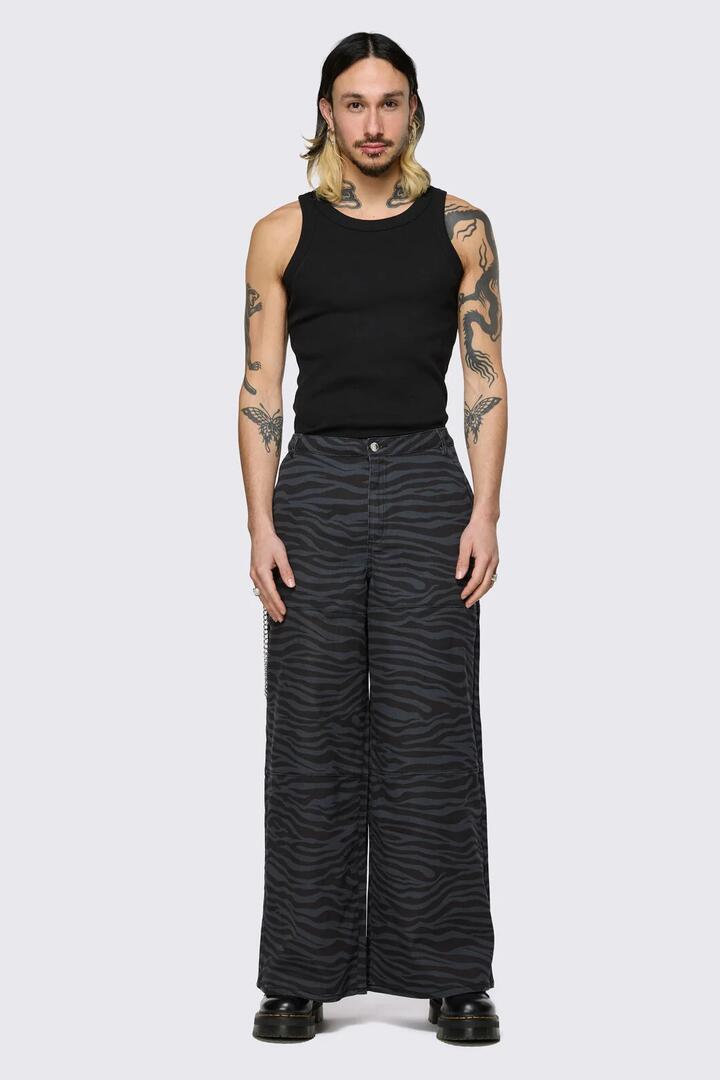 Image of a model wearing Pants. Product name - Untamed Cargo Pant in Black colour by brand - Dangerfield