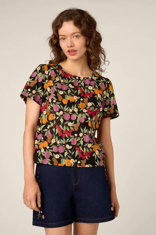 Image of a model wearing Tops. Product name - Butterfly & Fruit Top in Black colour by brand - Princess Highway
