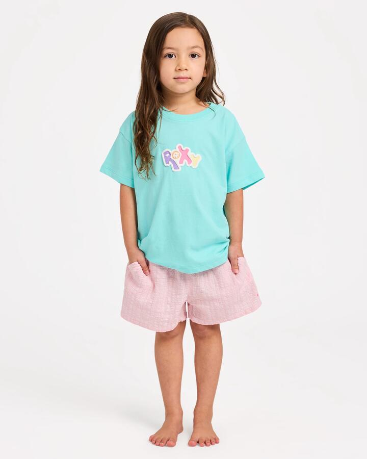 Image of a model wearing Shorts. Product name - Roxy Girls 2-7 Aloha Blush Elastic Waist Shorts Powder Pink in Powder Pink colour by brand - Roxy