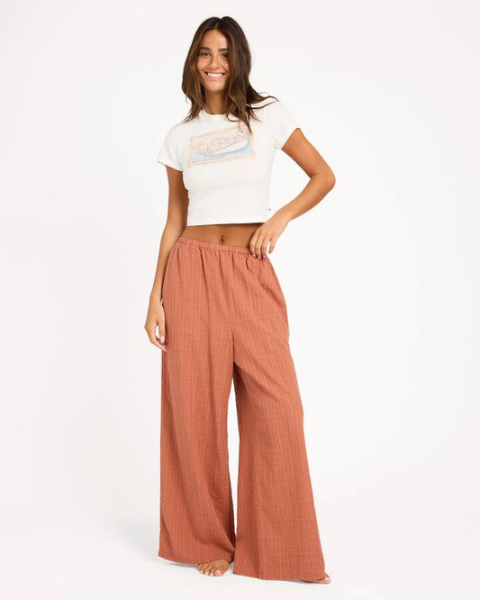 Image of a model wearing Pants. Product name - Roxy Womens Costa Check Elastic Waist Pants Chutney in Chutney colour by brand - Roxy