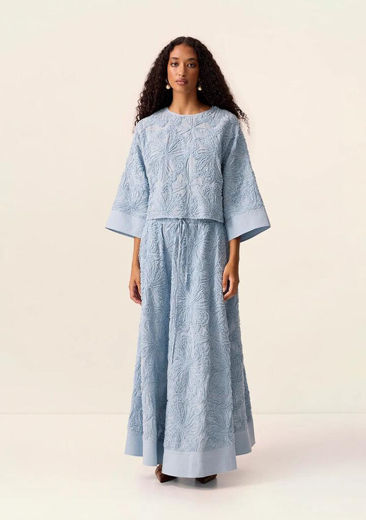 Image of a model wearing Skirts. Productname: Blossom Maxi Skirt in Wave colour by brand - MOS The Label