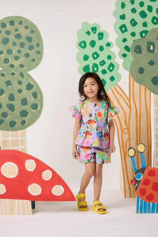 Image of a model wearing Tops. Product name - Woodend Kids Top in Lilac colour by brand - Gorman